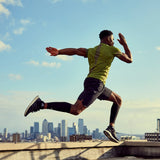 Fit male wears adidas Compression Calf Sleeve while completing cardio workout outdoors.