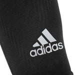adidas Compression Calf Sleeves are made from form fitting, stretchy material with a large adidas logo printed on the front.